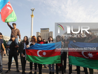 Azerbaijanis who live in Ukraine wave Azerbaijan's flag during their rally in support Azerbaijan against Armenia in the Nagorno-Karabakh con...