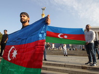 Azerbaijanis who live in Ukraine hold Azerbaijan's flag during their rally in support Azerbaijan against Armenia in the Nagorno-Karabakh con...