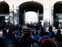 Entrance of the cars in which the different members of the government go in the royal palace while the protesters insult them and whistle Sp...
