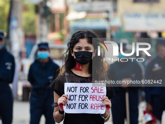 Nepalese youths stage a protest and a drama against rape in Kathmandu Nepal on October 12, 2020.  (