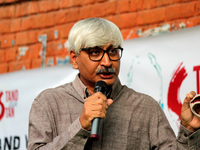Apoorvanand, professor at the Hindi Department, Faculty of Arts, University of Delhi addressing during the protest against the arrest of Sta...