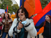 Protesters with national flags of Armenia during a rally in Vitosha Boulevard, in Sofia.
Members of the Armenian diaspora gathered in the ce...