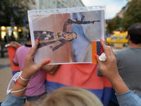 A protester holds an image of an Armenian fighter-woman during a rally in Sofia.
Members of the Armenian diaspora gathered in the center of...