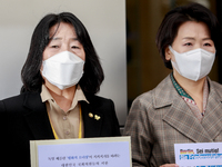(from left) Members parliament of the Democratic Party, Yoon Mi-hyang, Lee Soo-jin hold a press conference at in front of the German Embassy...