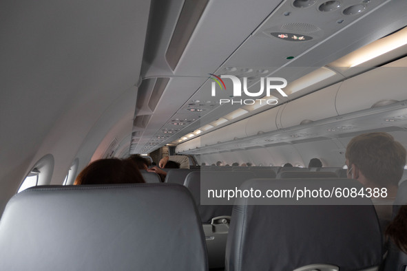 Interior of the cabin during the flight. Flying with Lauda Airbus A320 airplane with registration 9H-LMJ during the Covid-19 Coronavirus pan...