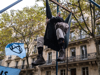 Activists of environmental protest group Extinction Rebellion (XR) on October 13, 2020 in Paris, during a protest as part of a week of actio...