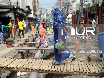 Citizens walking on the constructed street in Dhaka, Bangladesh, on October 13, 2020  (