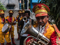 Indian Wedding Band perforn in Dum Dum, West Bengal, India on February 26, 2020. The practice of hiring an Indian wedding band baja (baja ro...