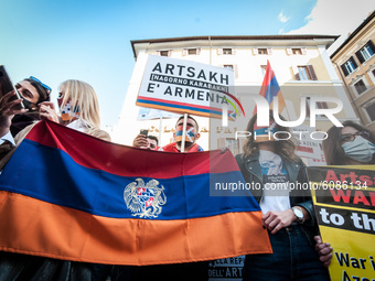 Demonstrator of the Armenian people hold banners and flag in Montecitorio Square, Rome, Italy, on October 13, 2020 to demand the Azeri cease...