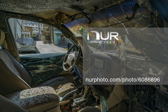 Aftermath of a direct impact of an azeri rocket on a car in the streets of Stepanakert during the clashes between Azerbaijan and Nagorno Kar...