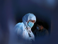 A woman wearing a protective face mask during a rally to show solidarity with hunger-striking Palestinian prisoner Maher Al-Akhras, who is h...