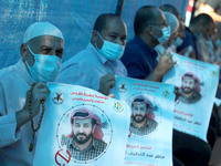 Palestinians take part in a protest to show solidarity with Maher Al-Akhras, 49, a Palestinian jailed by Israel, who has been on hunger stri...