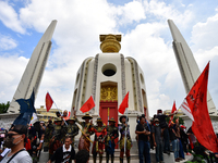 Pro-democracy protesters take part in an anti-government at Democracy Monument before marching to the Thai Government House in Bangkok on Oc...