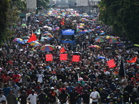 Pro-democracy protesters take part in an anti-government marching to the Thai Government House in Bangkok on October 14, 2020 in Bangkok, Th...