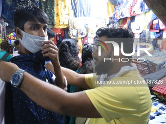 People crowed bussy to shopping at a City Maket Area ,Puja shopping. The crowd is expected to increase in the coming days.India coronavirus...