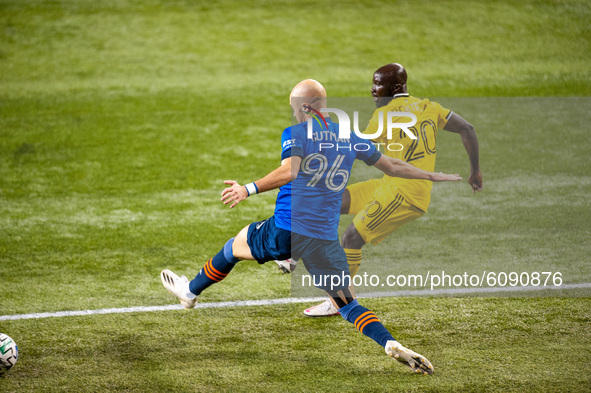 FC Cincinnati defender, Andrew Gutman, and Columbus midfielder, Emmanuel Boateng, compete for the ball during an MLS soccer match between FC...