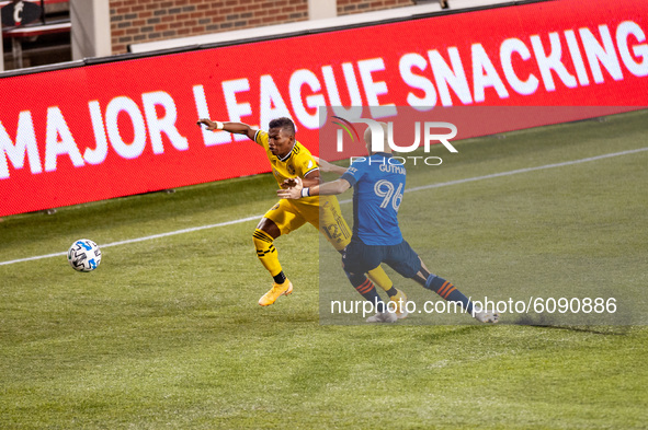 FC Cincinnati defender, Andrew Gutman, attempts to take the ball away from Columbus midfielder, Luis Diaz, during an MLS soccer match betwee...