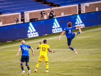 FC Cincinnati defender, Nick Hagglund, goes for the ball during an MLS soccer match between FC Cincinnati and the Columbus Crew at Nippert S...