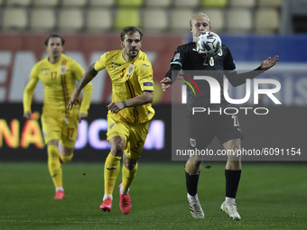 Xaver Schlager of Austria in action against Mihai Balasa of Romania during match against Romania of UEFA Nations League football match in Pl...