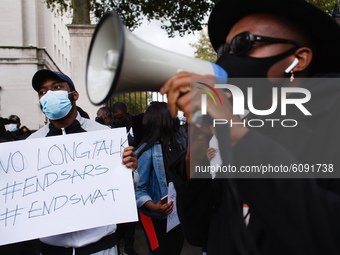 Activists protesting police brutality by the Nigerian Special Anti-Robbery Squad (SARS) demonstrate on Whitehall in London, England, on Octo...