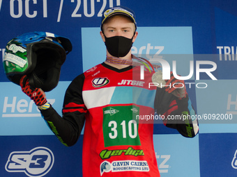 Ben Dignan, Vertigo Team (bronze medal) celebrate on the podium during the FIM Trial125 World Championships Lazzate, Italy, on October 11, 2...