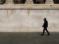 A man walk past the National Gallery as it is still nearly empty, after the lockdown due to the COVID-19 outbreak, London on October 15, 202...