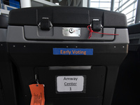 A tabulation machine is seen during the set up of an early voting site established by the City of Orlando and the Orlando Magic at the Amway...
