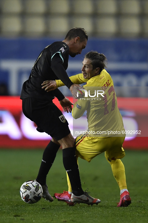 Stefan Ilsanker of Austria in action against Ciprian Deac of Romania during match against Romania of UEFA Nations League football match in P...