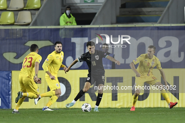Alessandro Schöpf of Austria in action against Nicusor Bancu of Romania of UEFA Nations League football match in Ploiesti city October 14, 2...