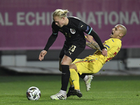 Xaver Schlager of Austria in action against Ionut Mitrita of Romania of UEFA Nations League football match in Ploiesti city October 14, 2020...