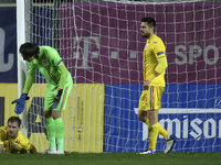 Mihai Balasa, Ciprian Tatarusanu and Andrei Burca of Roamnia react during of UEFA Nations League football match in Ploiesti city October 14,...