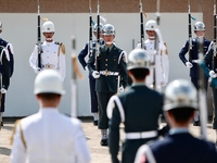Tri-Service Honor Guards under the Ministry of National Defense demonstrate and salute during a rehearsal at a military camp, in Taipei City...