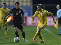 Alessandro Schöpf of Austria in action against Nicusor Bancu of Romania during the UEFA Nations League match between Romania v Austria, in P...