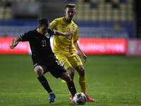 Nicusor Bancu of Romania in action against Stefan Lainer of Austria  during the UEFA Nations League match between Romania v Austria, in Ploi...