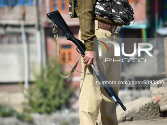  An Indian soldier stands alert during an anti-militancy operation launched by Indian forces in central Kashmir's Chadoora on October 16, 20...