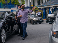 Malaysia opposition leader Anwar Ibrahim speaks to the journalist after leaving the police headquarters in Kuala Lumpur, Malaysia, on Octobe...