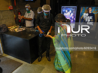 Thermal checking at entry point of a movie theater in Kolkata, India, on October 16, 2020. Cinema halls are permitted to open with 50 % audi...