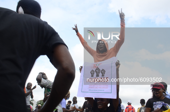 A Youth of End Sars Protesters hold a placard with description (ENDSARS) to barricade the Lagos - Ibadan expressway, the oldest highway and...