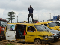 A bus driver in traffic stand on his bus as Youth of End Sars Protesters continue to barricade the Lagos - Ibadan expressway, the oldest hig...