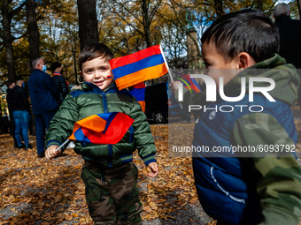 Two little Armenian boys are playing with Rmenian flags, during the Armenian community protest against Israel's arms deliveries to Azerbaija...