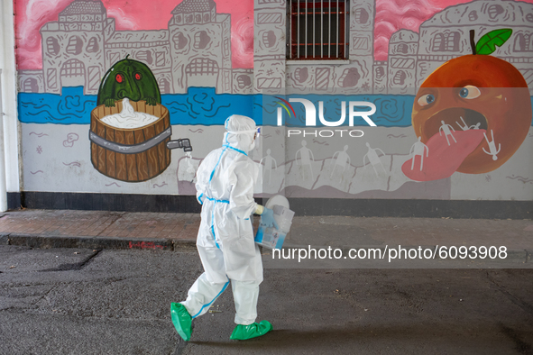 Health workers collect swab in Turin, Italy, on October 16, 2020. Many places of  sanitary test are put in place to contrast the spread of S...