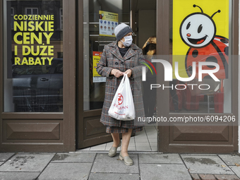 A woman wears a face mask during coronavirus pandemic. Krakow, Poland on October 15th, 2020. Due to the increasing spread of COVID-19 in Pol...