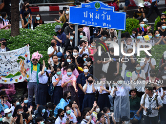 Pro-democracy protesters take part in an anti-government at Pathum Wan intersection central of Bangkok near Royal Thai Police Headquarter on...