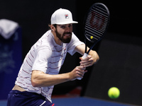 Reilly Opelka of United States returns the ball to Borna Coric of Croatia during their ATP St. Petersburg Open 2020 international tennis tou...
