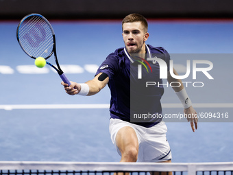 Borna Coric of Croatia returns the ball to Reilly Opelka of United States during their ATP St. Petersburg Open 2020 international tennis tou...