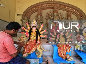 Jaipur: An artisan gives the final touches to an idol of Goddess Durga ahead of the Durga Puja festival, in Jaipur,Rajasthan ,India, Friday,...