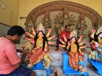 Jaipur: An artisan gives the final touches to an idol of Goddess Durga ahead of the Durga Puja festival, in Jaipur,Rajasthan ,India, Friday,...