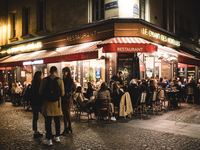 In the Parisian district of Le Sentier, the brasseries and restaurants are full as the curfew introduced to deal with the outbreak of the co...