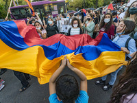 Protesters shake an armenian flag during a demonstration in Yerevan, Armenia, on October 16, 2020 for the recognition of Nagorno Karabakh as...