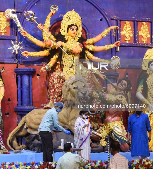 West Bengal Chief Minister Mamata Banerjee (C)   inaugurates temporary platform  of  a community  Durga Puja pandal  is decorated in Kolkata...